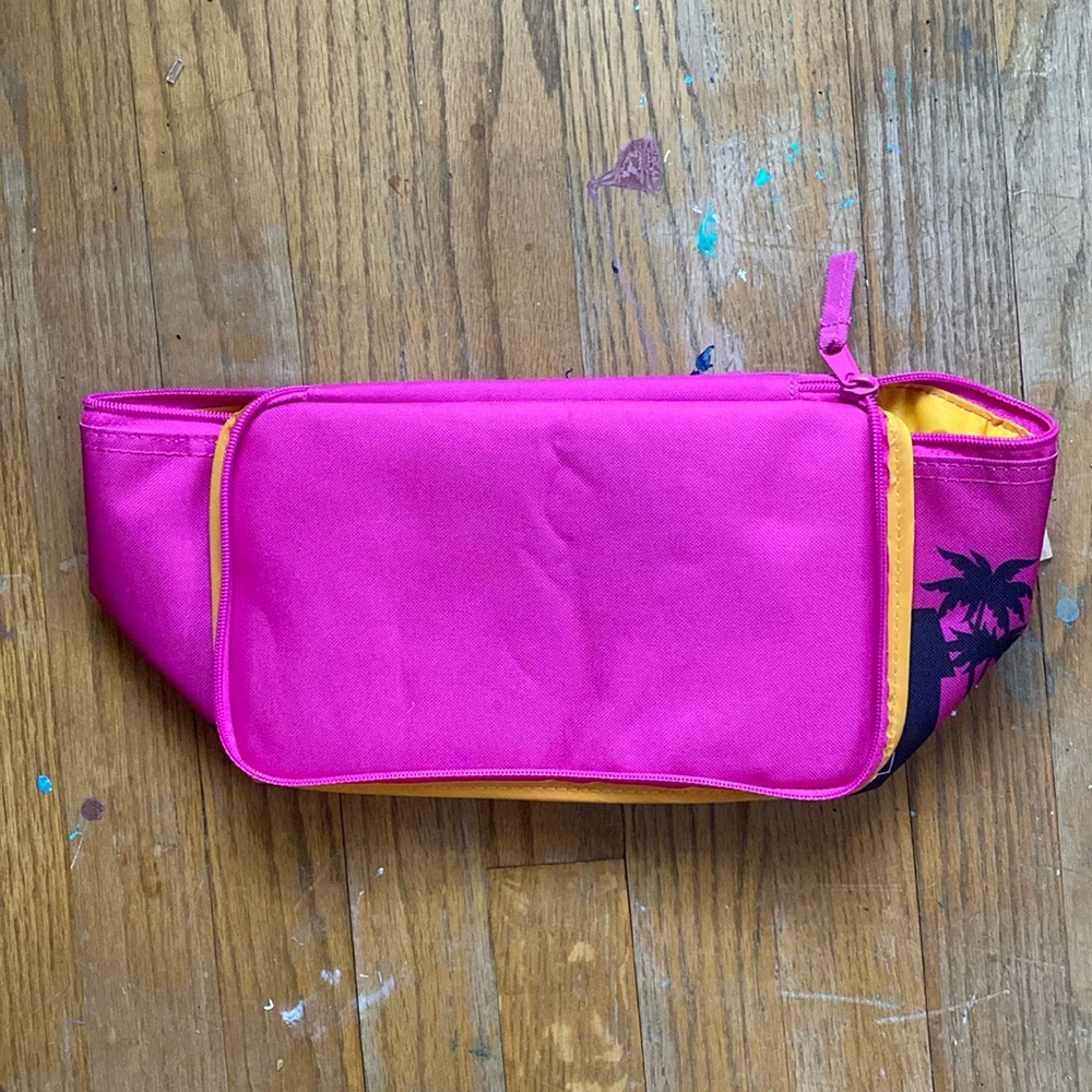 Trader Joe’s, mini cooler bag and hot pink. Brand new with tags.